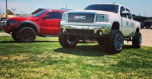 white lifted GMC Sierra truck with oversize tires | See more about Trucks.