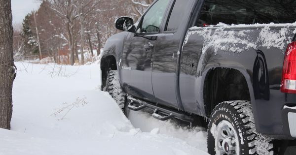Black lifted GMC Sierra stuck in The Pas Manitoba winter snow | See more about Winter Snow, Snow and Cars.