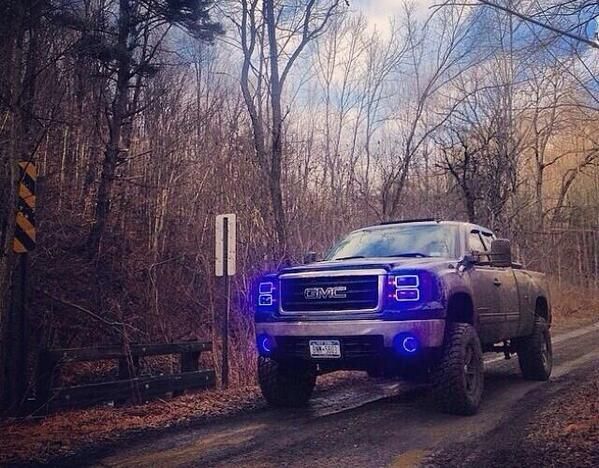 Lifted GMC Sierra truck - bright blue Led headlamps muddy | See more about Trucks, Led and Photos.